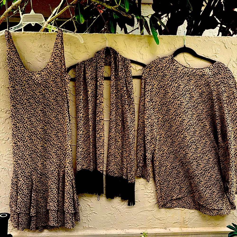 Bloomingdale’s animal print. 100% silk dresses and scarf.Very light and pretty 8